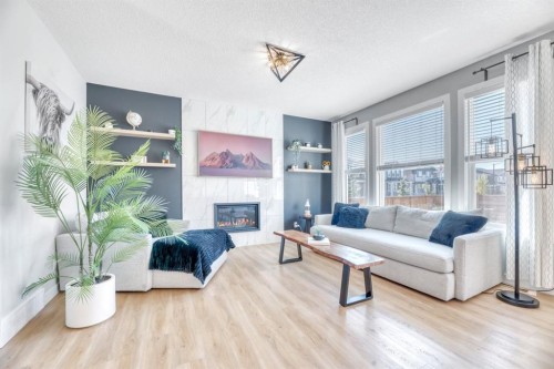 303 Dawson Harbour Court, Chestermere, AB - Indoor Photo Showing Living Room With Fireplace