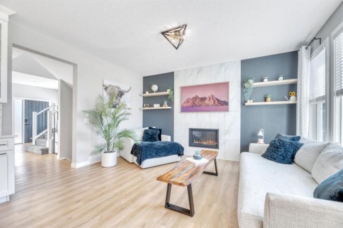 303 Dawson Harbour Court, Chestermere, AB - Indoor Photo Showing Living Room With Fireplace