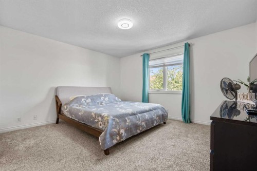 92 Cranston Drive Se, Calgary, AB - Indoor Photo Showing Bedroom