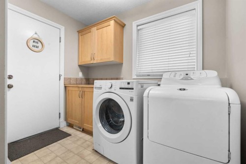 92 Cranston Drive Se, Calgary, AB - Indoor Photo Showing Laundry Room