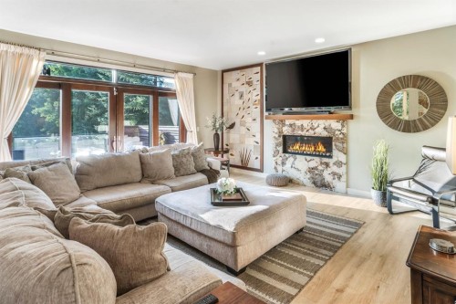27 Snowberry Gate, Rural Rocky View County, AB - Indoor Photo Showing Living Room With Fireplace