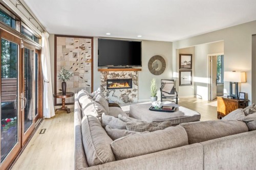 27 Snowberry Gate, Rural Rocky View County, AB - Indoor Photo Showing Living Room With Fireplace