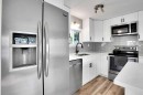 64 Huntwell Way Ne, Calgary, AB  - Indoor Photo Showing Kitchen With Double Sink With Upgraded Kitchen 