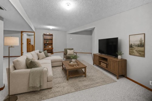30 Gleneagles View, Cochrane, AB - Indoor Photo Showing Living Room