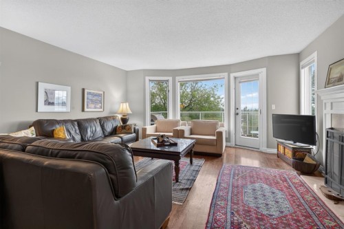 1924 29 Avenue South, Calgary, AB - Indoor Photo Showing Living Room With Fireplace