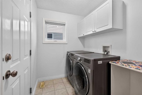 126 Bridlewood Way Sw, Calgary, AB - Indoor Photo Showing Laundry Room