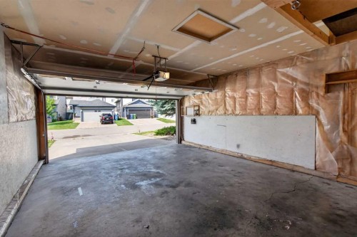 126 Bridlewood Way Sw, Calgary, AB - Indoor Photo Showing Garage