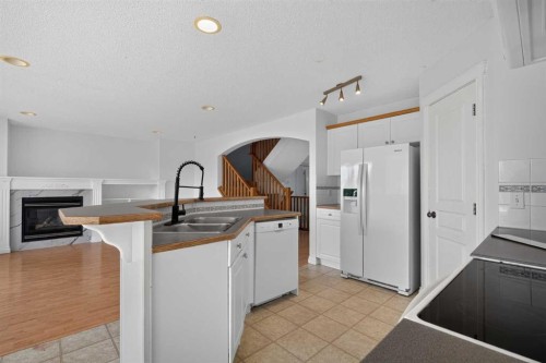 126 Bridlewood Way Sw, Calgary, AB - Indoor Photo Showing Kitchen With Double Sink