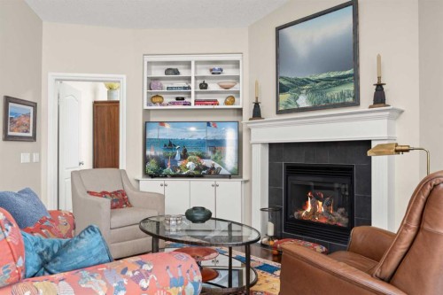 51 Elysian Crescent Sw, Calgary, AB - Indoor Photo Showing Living Room With Fireplace