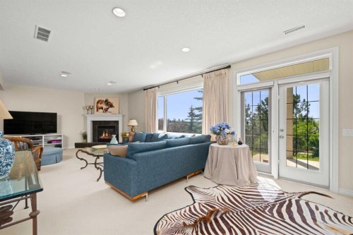 51 Elysian Crescent Sw, Calgary, AB - Indoor Photo Showing Living Room With Fireplace