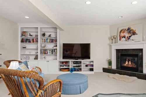 51 Elysian Crescent Sw, Calgary, AB - Indoor Photo Showing Living Room With Fireplace