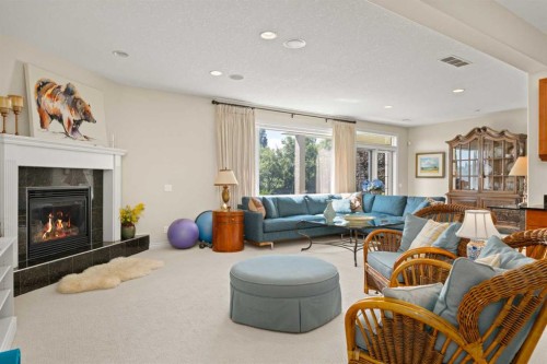 51 Elysian Crescent Sw, Calgary, AB - Indoor Photo Showing Living Room With Fireplace