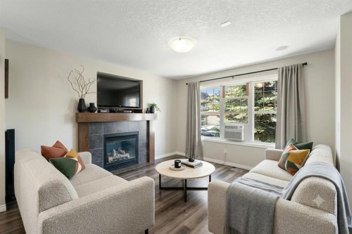 70 Walden Manor Se, Calgary, AB - Indoor Photo Showing Living Room With Fireplace