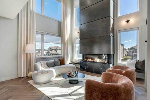 147 Siltstone Place, Balzac, AB - Indoor Photo Showing Living Room With Fireplace