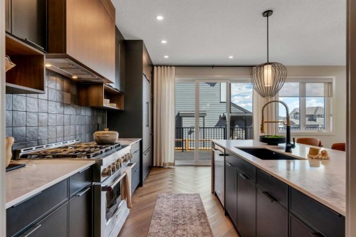 147 Siltstone Place, Balzac, AB - Indoor Photo Showing Kitchen With Double Sink With Upgraded Kitchen