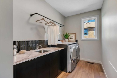 147 Siltstone Place, Balzac, AB - Indoor Photo Showing Laundry Room