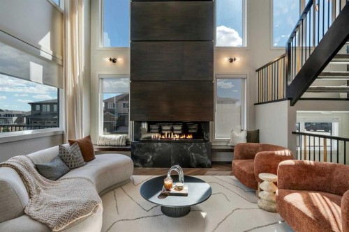 147 Siltstone Place, Balzac, AB - Indoor Photo Showing Living Room With Fireplace