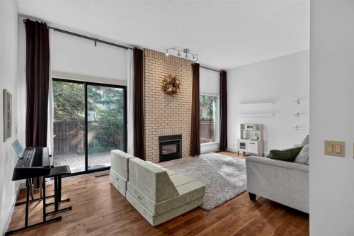 571 Point Mckay Grove Nw, Calgary, AB - Indoor Photo Showing Living Room With Fireplace