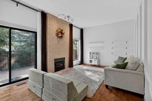 571 Point Mckay Grove Nw, Calgary, AB - Indoor Photo Showing Living Room With Fireplace