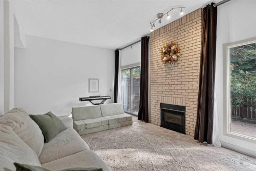 571 Point Mckay Grove Nw, Calgary, AB - Indoor Photo Showing Living Room With Fireplace