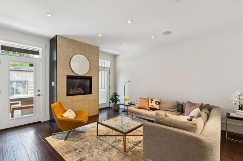 4417 16A Street Sw, Calgary, AB - Indoor Photo Showing Living Room With Fireplace