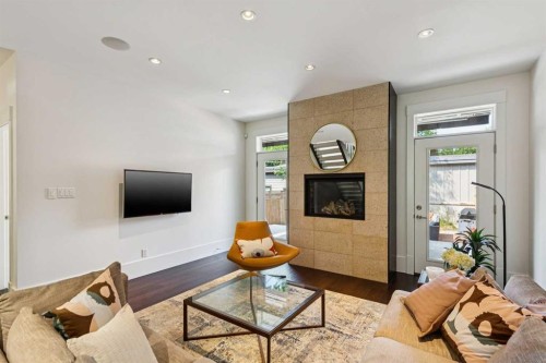 4417 16A Street Sw, Calgary, AB - Indoor Photo Showing Living Room With Fireplace