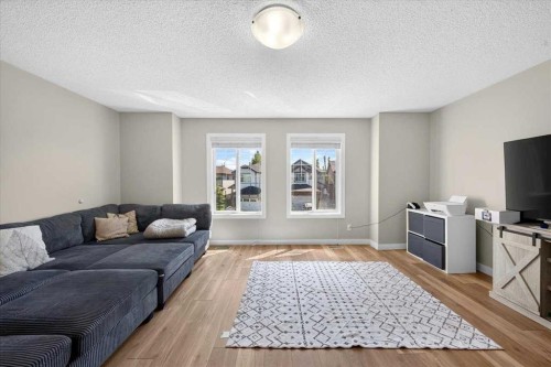 251 Hillcrest Circle Sw, Airdrie, AB - Indoor Photo Showing Living Room