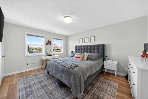251 Hillcrest Circle Sw, Airdrie, AB - Indoor Photo Showing Bedroom