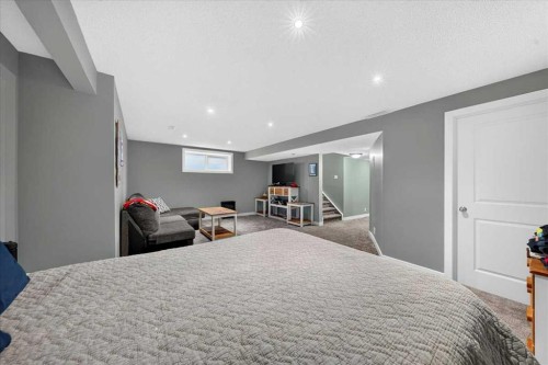 251 Hillcrest Circle Sw, Airdrie, AB - Indoor Photo Showing Bedroom