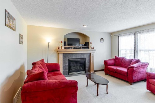 23 Royal Oak Terrace Nw, Calgary, AB - Indoor Photo Showing Living Room With Fireplace