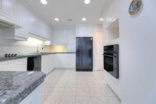 8 Prominence Path Sw, Calgary, AB - Indoor Photo Showing Kitchen With Upgraded Kitchen