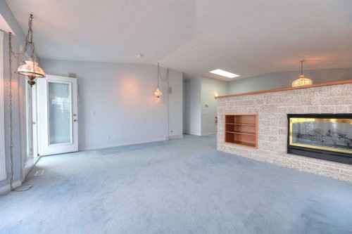 8 Prominence Path Sw, Calgary, AB - Indoor With Fireplace