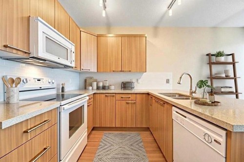 131-300 Marina Drive, Chestermere, AB - Indoor Photo Showing Kitchen With Double Sink