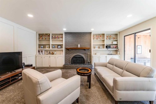 240 Canterville Drive Sw, Calgary, AB - Indoor Photo Showing Living Room With Fireplace