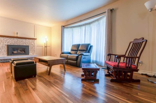 240 Canterville Drive Sw, Calgary, AB - Indoor Photo Showing Living Room With Fireplace
