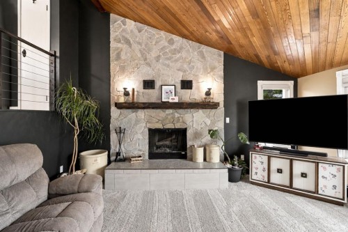 218 8 Avenue Ne, Sundre, AB - Indoor Photo Showing Living Room With Fireplace