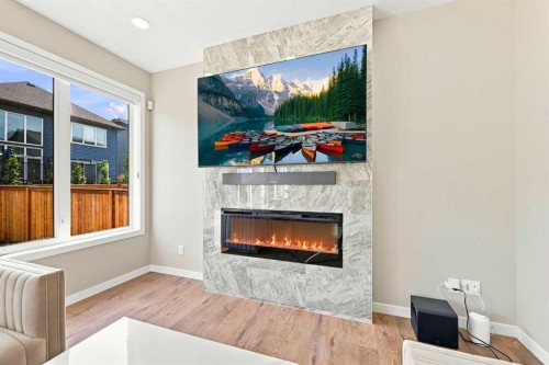 945 Chinook Winds Sw, Airdrie, AB - Indoor Photo Showing Living Room With Fireplace