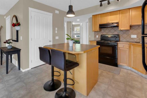 411-140 Sagewood Boulevard Sw, Airdrie, AB - Indoor Photo Showing Kitchen
