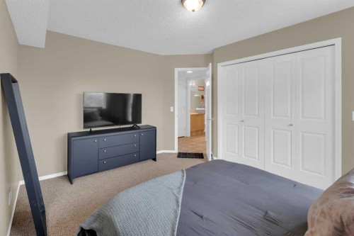 411-140 Sagewood Boulevard Sw, Airdrie, AB - Indoor Photo Showing Bedroom
