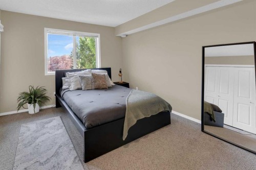 411-140 Sagewood Boulevard Sw, Airdrie, AB - Indoor Photo Showing Bedroom
