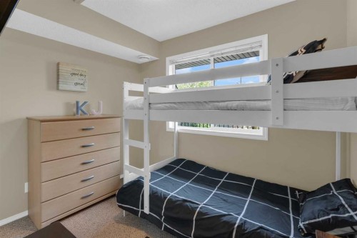 411-140 Sagewood Boulevard Sw, Airdrie, AB - Indoor Photo Showing Bedroom