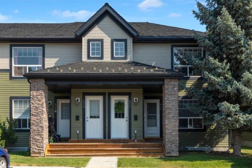 411-140 Sagewood Boulevard Sw, Airdrie, AB - Outdoor With Deck Patio Veranda With Facade