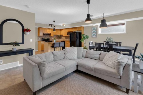 411-140 Sagewood Boulevard Sw, Airdrie, AB - Indoor Photo Showing Living Room