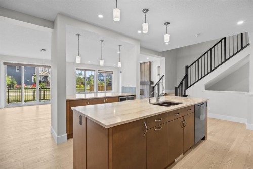 192 Magnolia Manor Se, Calgary, AB - Indoor Photo Showing Kitchen With Double Sink
