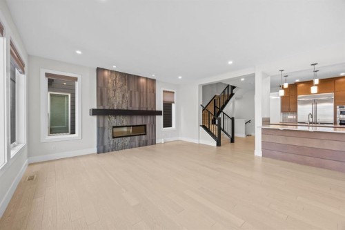192 Magnolia Manor Se, Calgary, AB - Indoor Photo Showing Living Room With Fireplace
