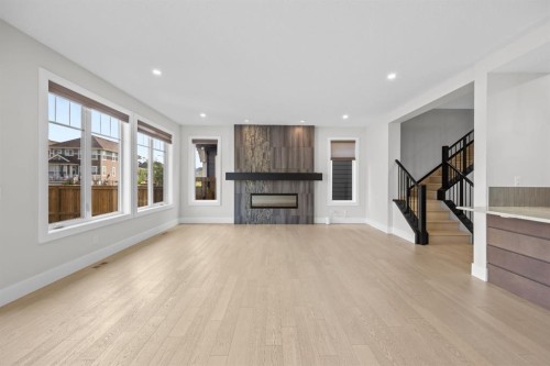 192 Magnolia Manor Se, Calgary, AB - Indoor Photo Showing Living Room With Fireplace