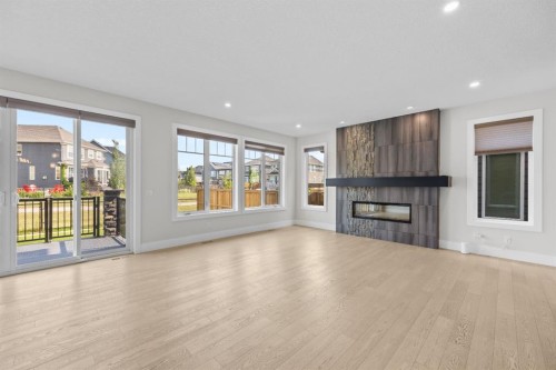 192 Magnolia Manor Se, Calgary, AB - Indoor Photo Showing Living Room With Fireplace
