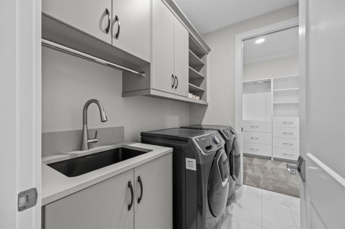 192 Magnolia Manor Se, Calgary, AB - Indoor Photo Showing Laundry Room