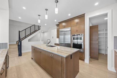 192 Magnolia Manor Se, Calgary, AB - Indoor Photo Showing Kitchen With Double Sink With Upgraded Kitchen