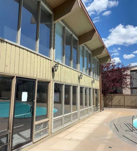 108-816 89 Avenue Sw, Calgary, AB - Outdoor With In Ground Pool With Exterior